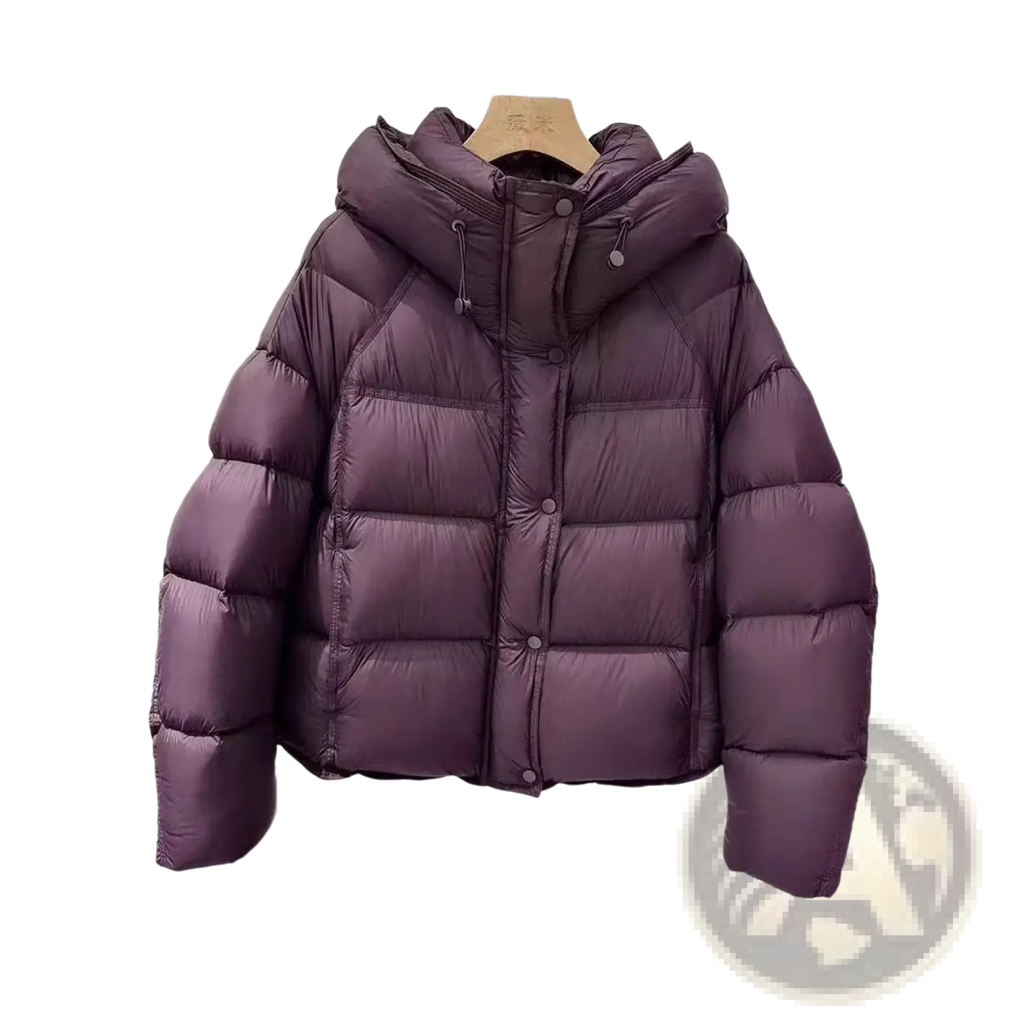 A plush purple quilted down winter jacket for women with a hood and button closure for cold weather use