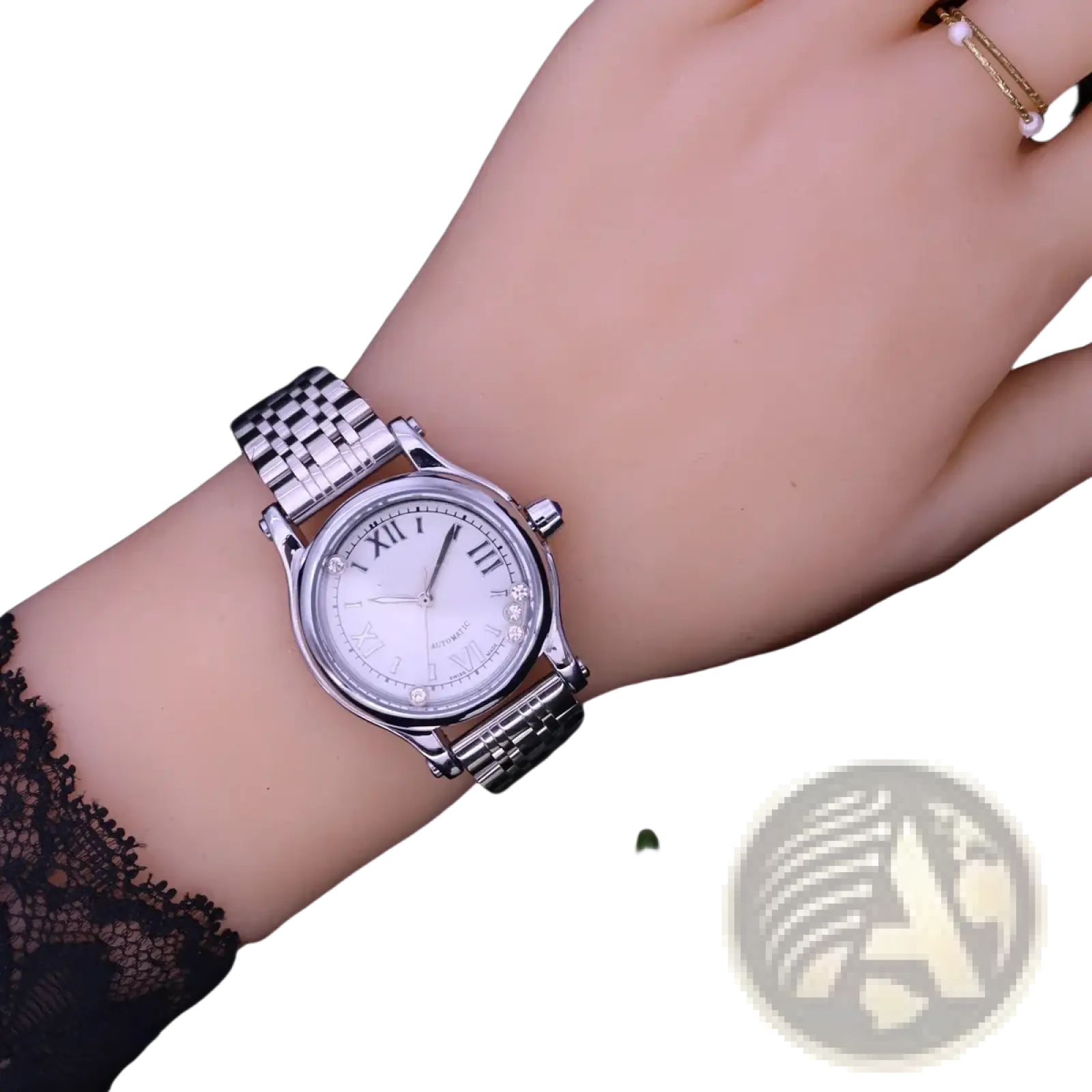 Silver-toned stainless steel women’s quartz leather dress watch with white dial, roman numerals, and crystal bezel accents