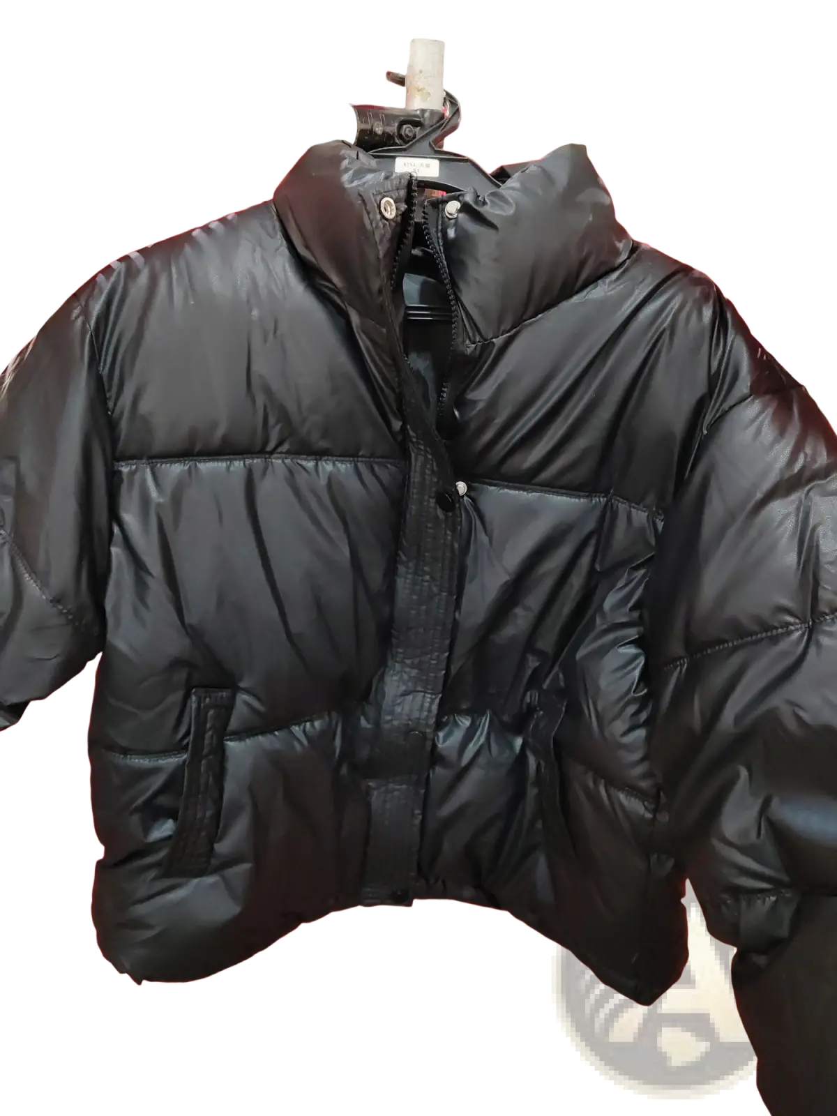 Women’s quilted puffer jacket in black with a shiny quilted exterior and a high collar for cold weather