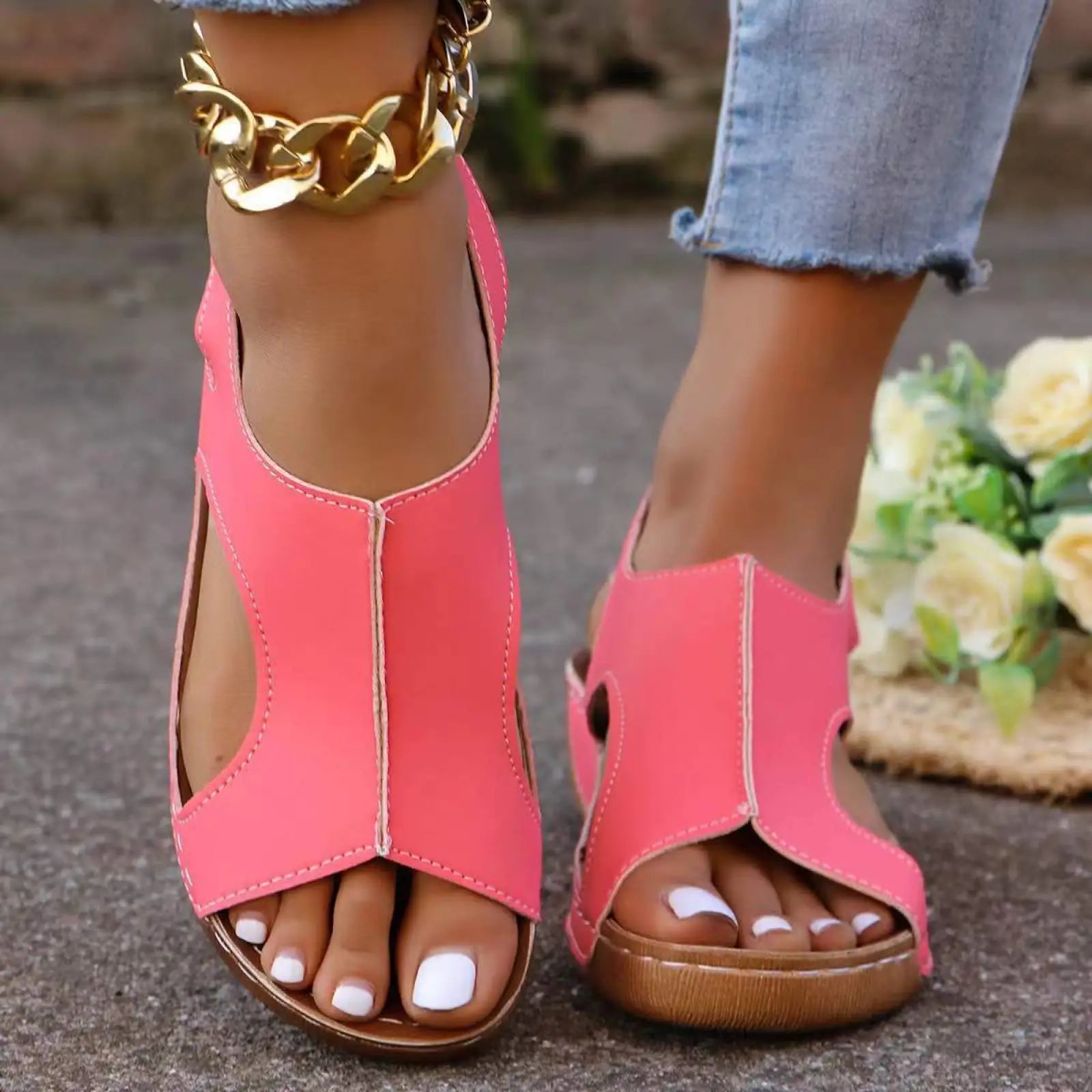 Bright pink women’s recycled leather elastic summer wedge sandals with chunky brown sole and gold toned chain anklet