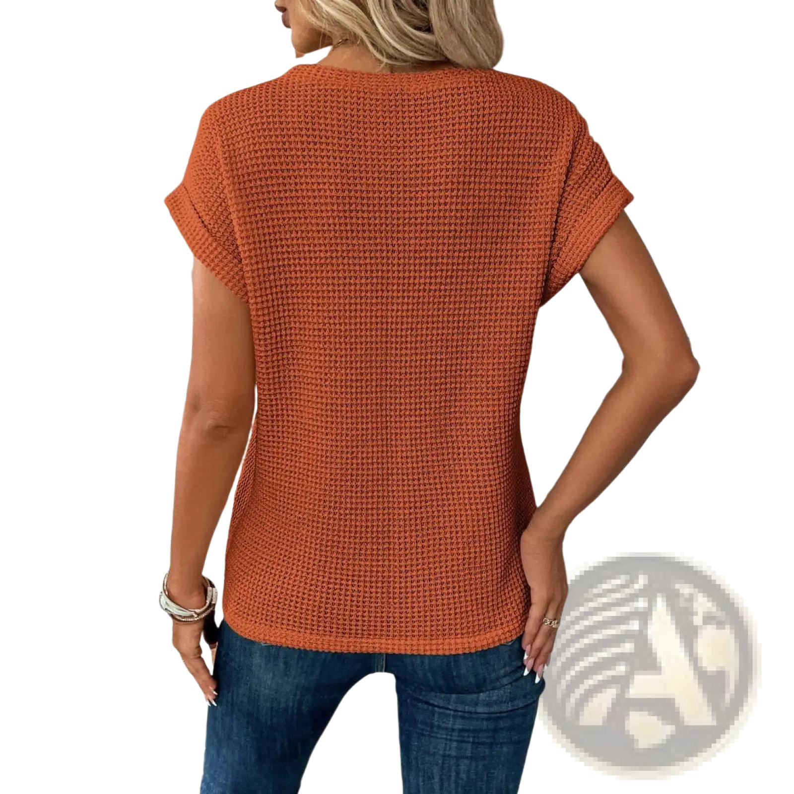 A cozy rust orange relaxed fit waffle knit short sleeve top for women with breathable textured fabric