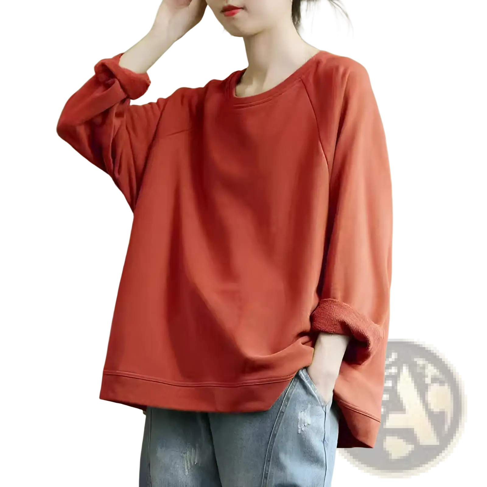 A soft rust-colored women’s relaxed oversized cotton blend pullover sweatshirt with long sleeves and rolled-up cuffs