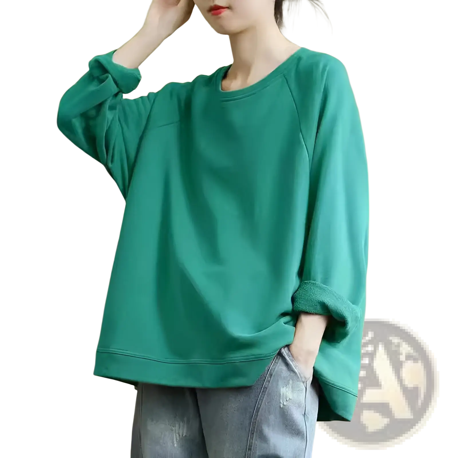 A soft teal women’s relaxed oversized cotton blend pullover sweatshirt with long sleeves and ribbed cuffs