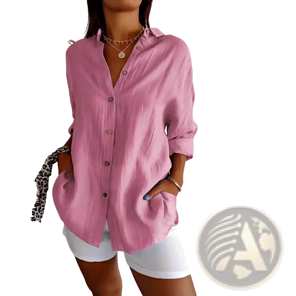 Women’s relaxed pink button-up shirt with pleated design and rolled sleeves in soft breathable fabric