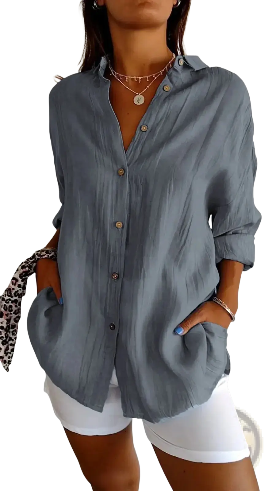 Women’s relaxed pleated button up shirt in light blue with rolled sleeves and subtle textured fabric