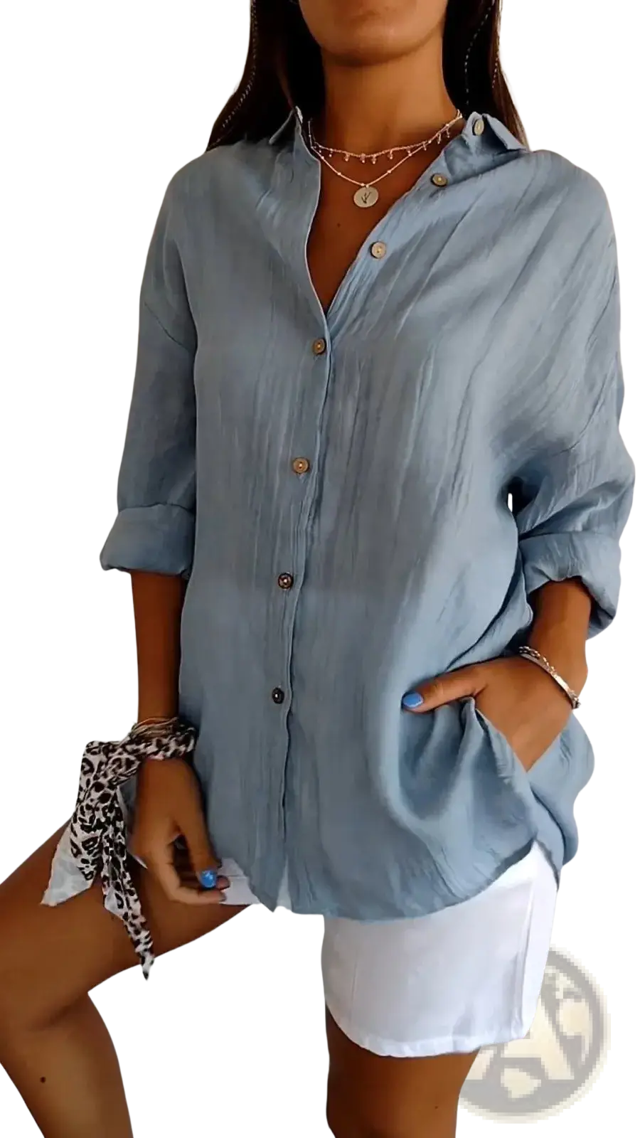 Women’s relaxed pleated light blue linen button up shirt with rolled sleeves and a textured finish