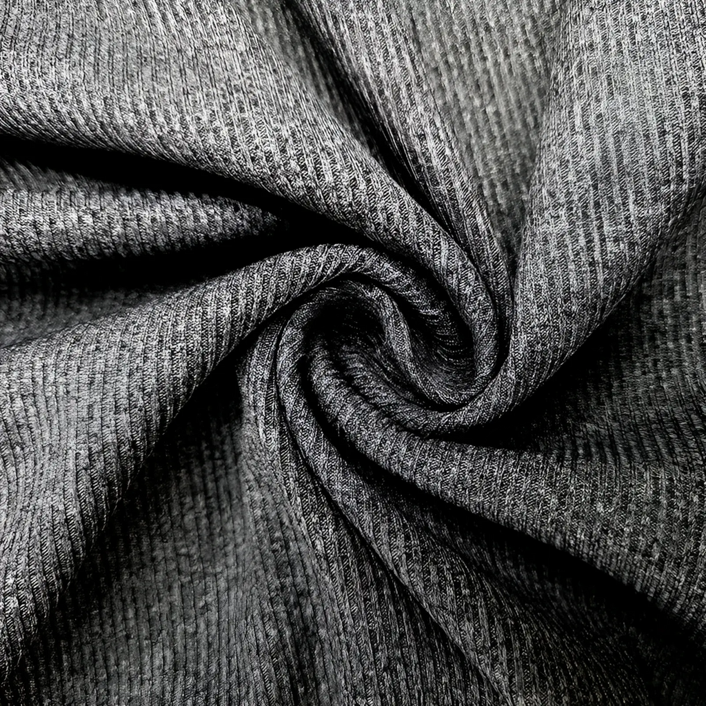 A close-up of a dark gray textured knit women’s ruffled ribbed slim fit mock neck top fabric detail