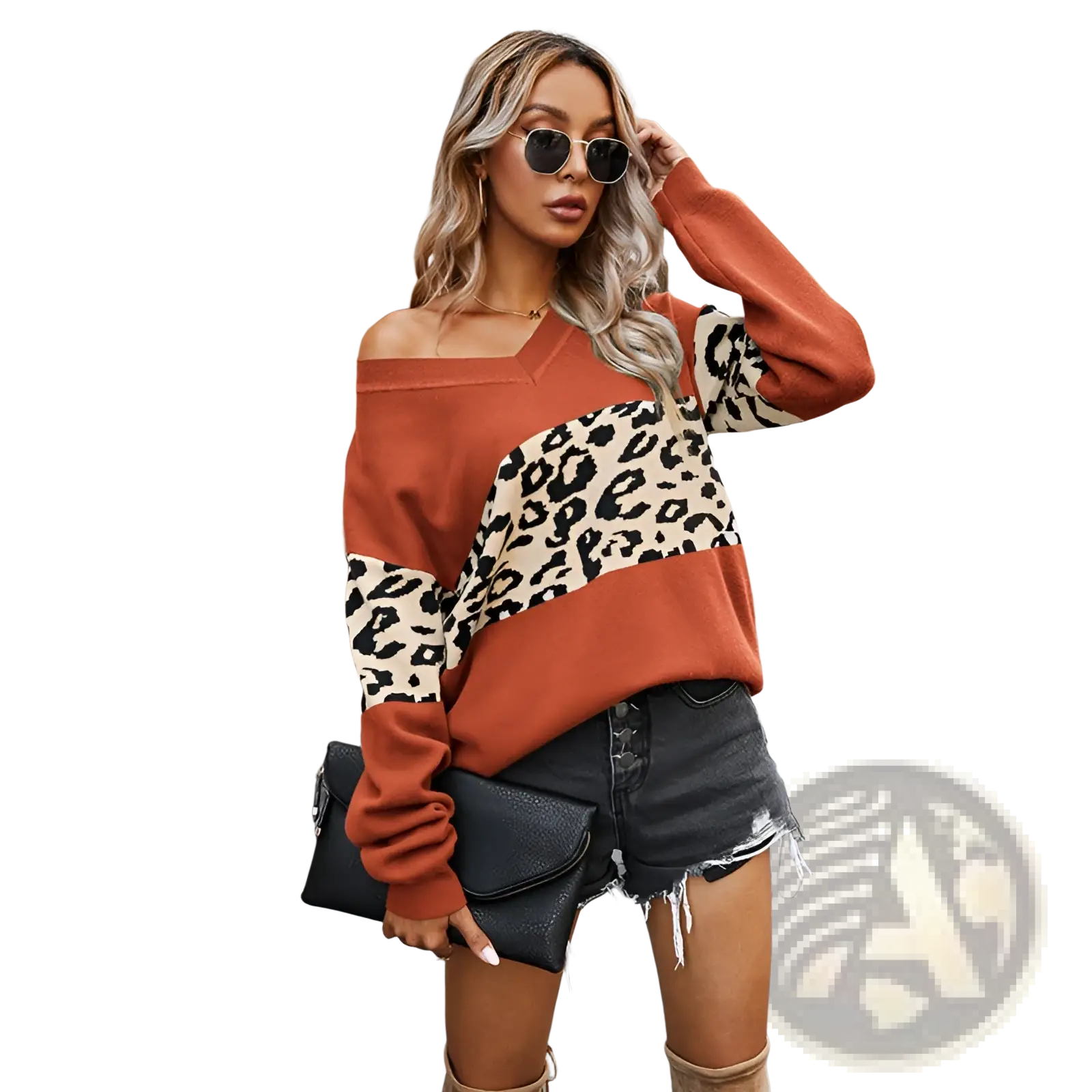 A black textured clutch purse with flap closure paired with a women’s off shoulder leopard print spliced sweatshirt
