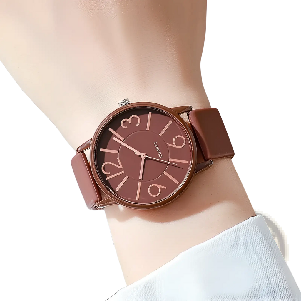 Women’s minimalist silicone quartz watch with brown leather strap matching brown dial and rose gold-tone numerals