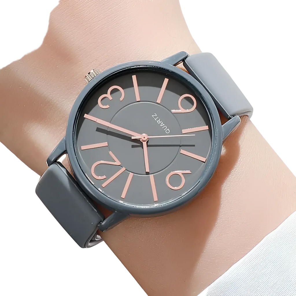 Gray quartz women’s silicone quartz watch with rose gold-tone numerals and hands featuring a casual minimalist design