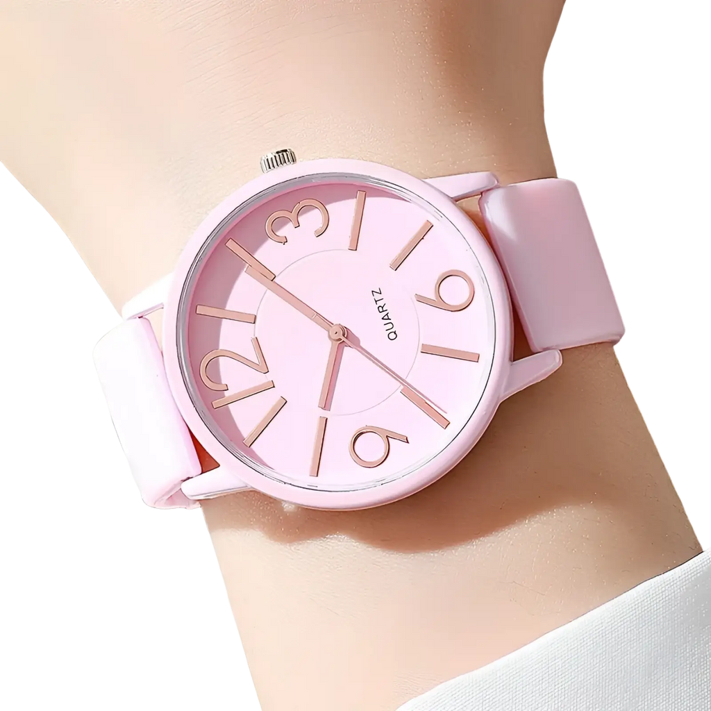 Women’s silicone quartz watch with pink dial matching silicone strap and rose gold-tone numerals minimalist design