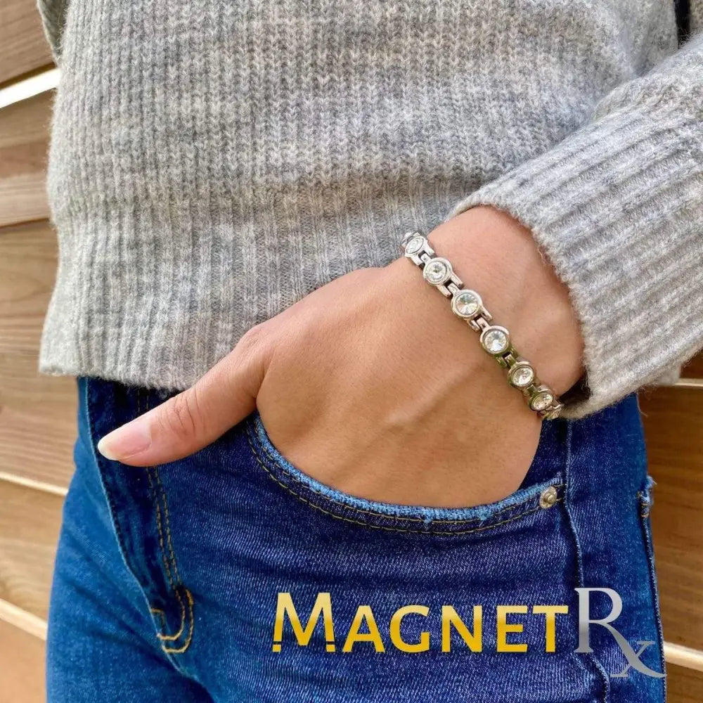 Women’s silver magnetic therapy tennis bracelet featuring clear round crystals in a linked design