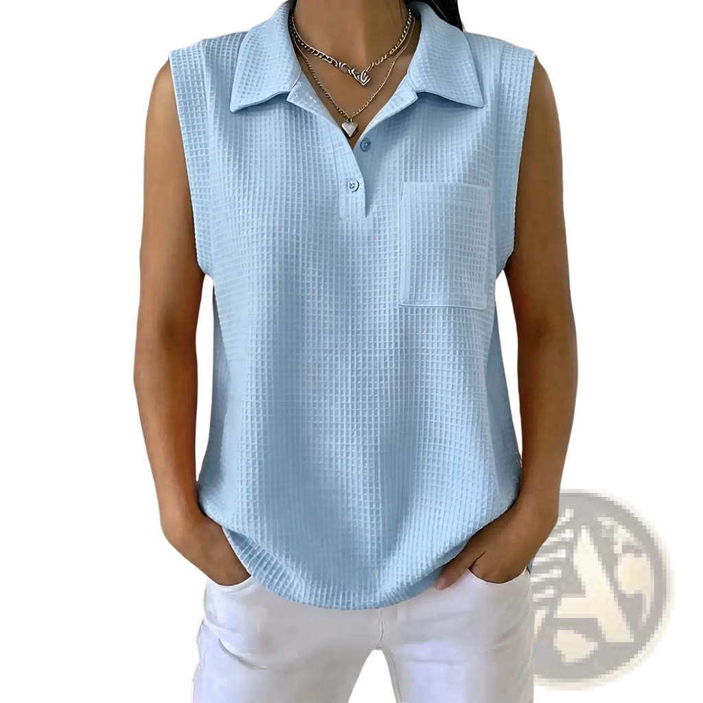 Light blue womens sleeveless knitted polo shirt with textured waffle weave and buttoned placket