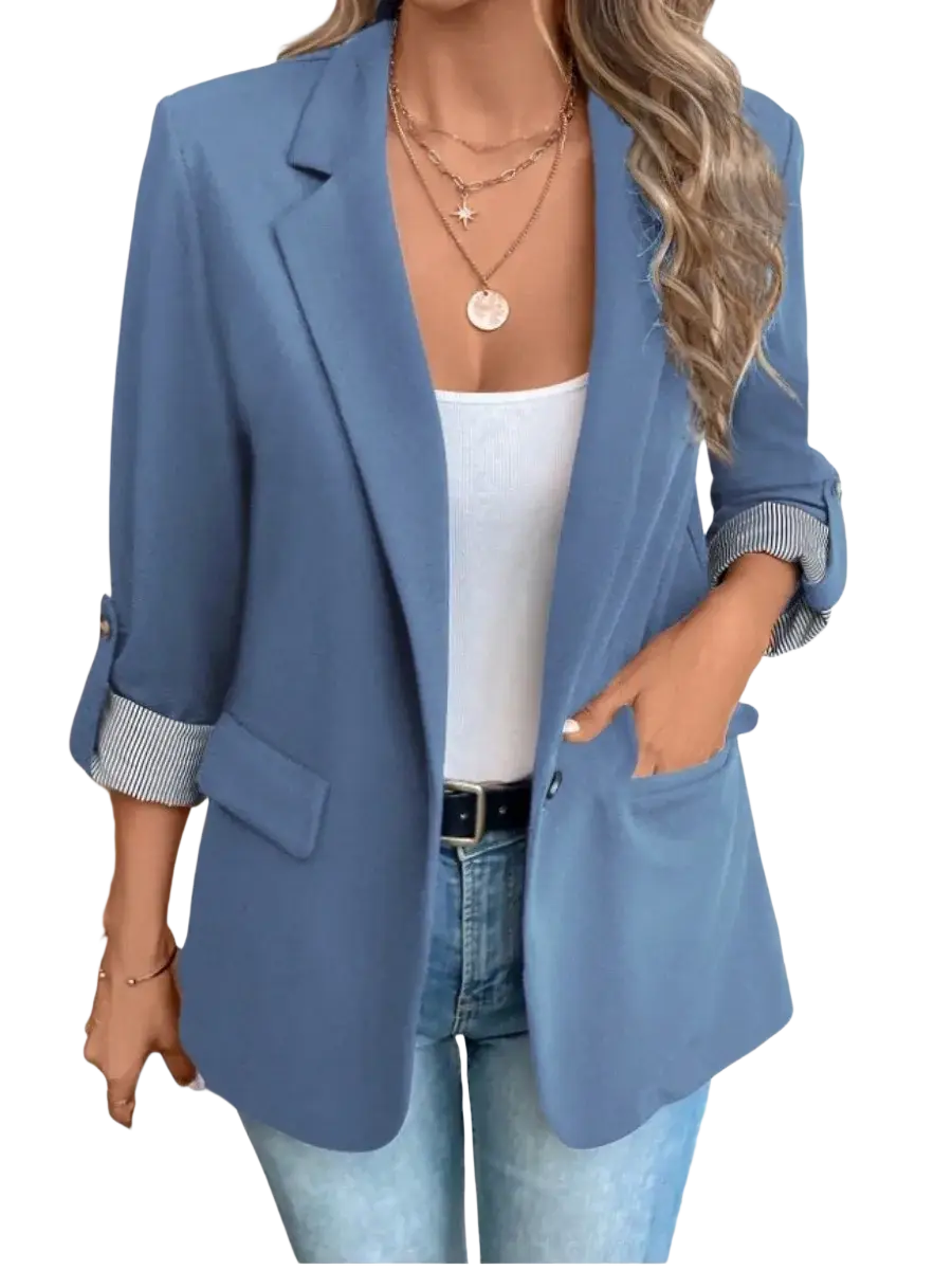 Women’s slim fit casual blazer jacket in blue with rolled-up sleeves showing striped cuffs and a subtle sheen