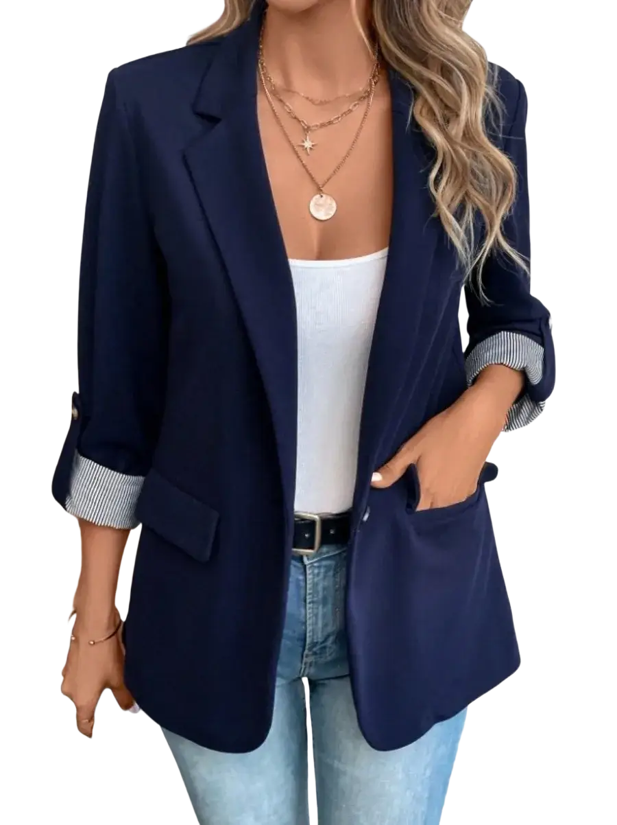 Navy blue women’s slim fit casual blazer jacket with rolled-up sleeves revealing striped cuffs and tailored fit