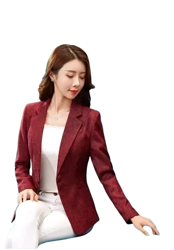 A woman wears a burgundy slim fit herringbone blazer suit jacket with textured woven fabric and vertical pleats