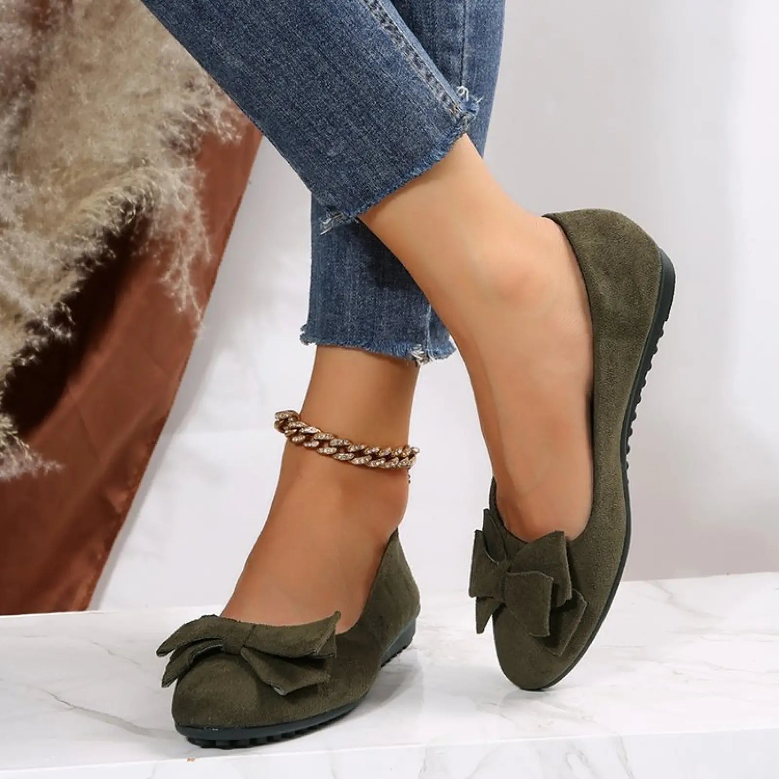 Women’s olive green suede bow round toe flat gommino loafers with a prominent bow at the toe for elegant wear
