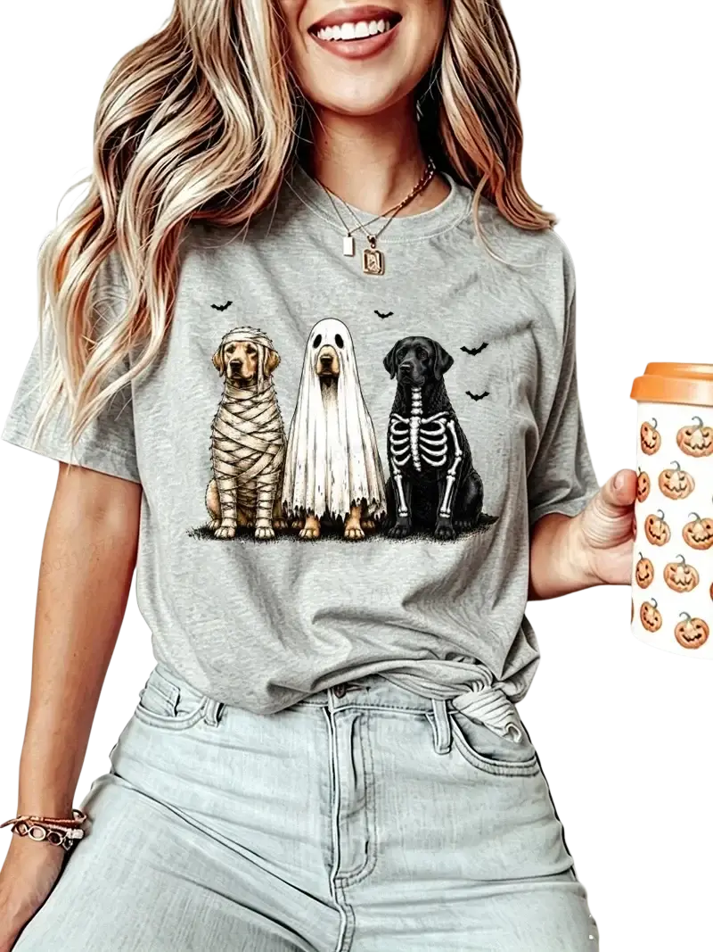 Gray women’s short sleeve t-shirt featuring Halloween dog graphic of three dogs dressed as mummy ghost and skeleton
