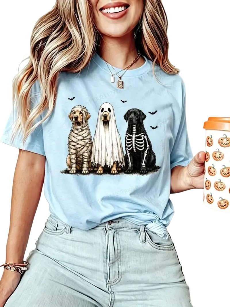 Light blue women’s short sleeve t-shirt featuring three dogs dressed as mummy ghost and skeleton for Halloween