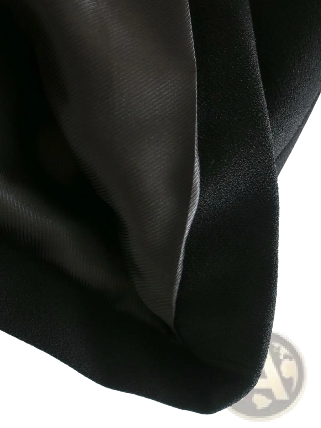 Women’s tailored double breasted longline blazer coat in black satin fabric with smooth glossy finish and subtle sheen