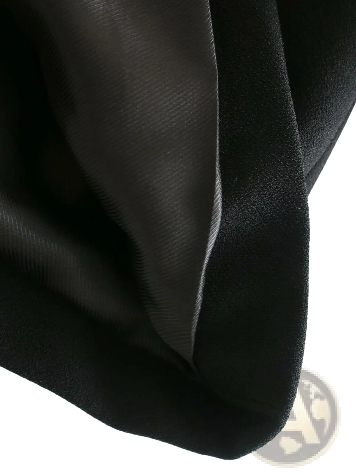 Women’s tailored double breasted longline blazer coat in black satin fabric with smooth glossy finish and subtle sheen