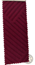 Maroon womens textured knit buttoned long sleeve hoodie fabric swatch with diagonal ribbed texture