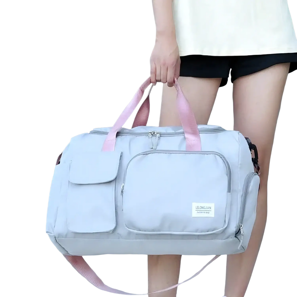 Light gray women’s travel duffle bag with pink handles and multiple pockets for gym and travel use