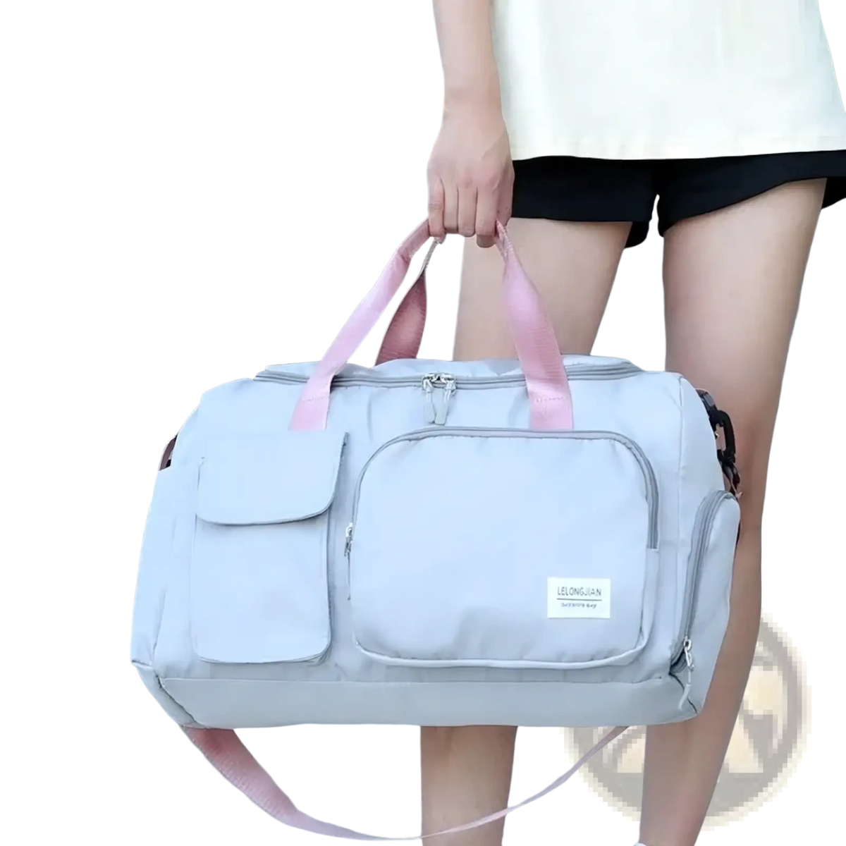 Light gray women’s travel duffle bag with pink handles and multiple pockets for gym and travel use