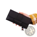 Black leather women’s tri-fold clutch wallet with flap closure and stitched detailing featuring card slots