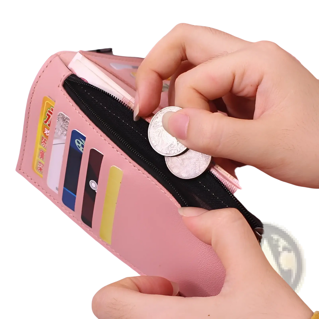 Women’s tri-fold leather clutch wallet in pink with black zipper and multiple card slots for organized storage