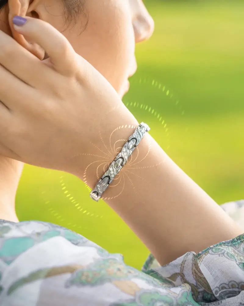 Women’s silver crystal xo neodymium magnetic bracelet with silver-toned intricate linked design and embedded gemstones