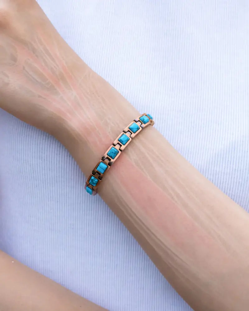 Rose gold pure copper magnetic bracelet with square turquoise stones in a sleek segmented design