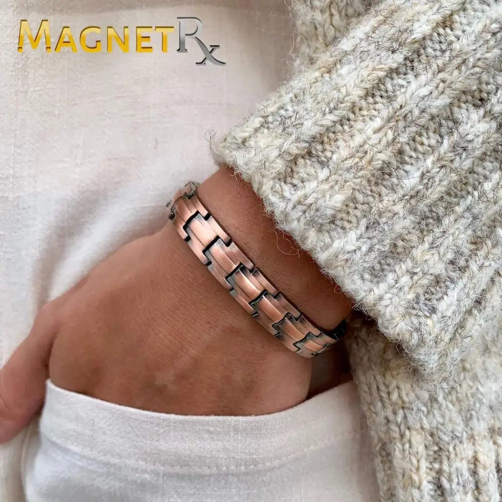 Rose gold pure copper magnetic therapy link bracelet with sleek interlocking design worn on a wrist