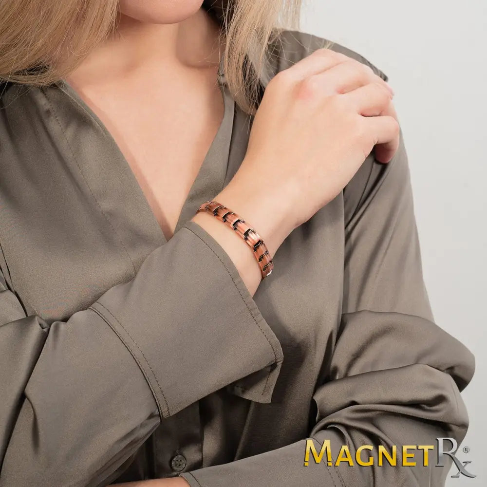 Rose gold pure copper magnetic therapy link bracelet with sleek interlocking design worn on the wrist