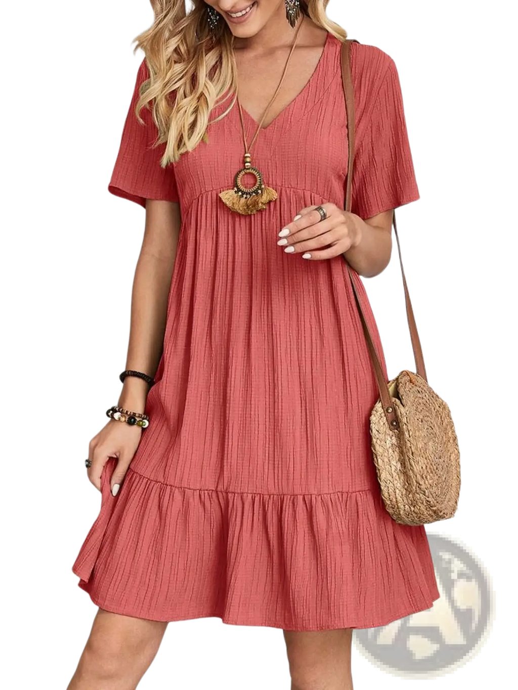 A soft coral-colored women’s v-neck tiered pleated summer dress with short sleeves and a ruffled hem