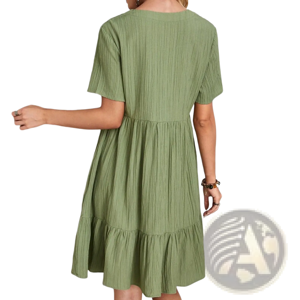 A soft olive green women’s v-neck tiered pleated summer dress with ribbed texture and short sleeves