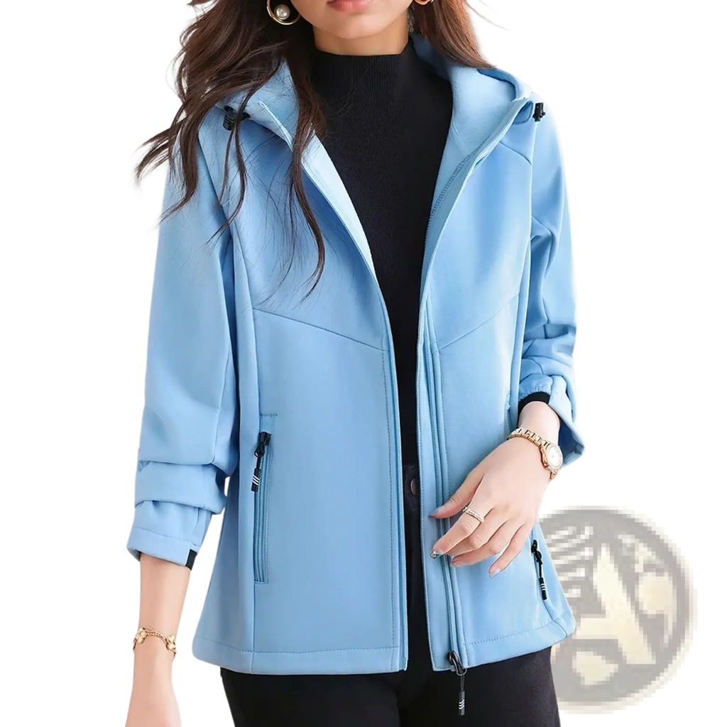 Light blue waterproof fleece hiking jacket for women with hood and zippered pockets in soft shell material