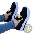 Black suede womens wedge slip-on sneakers with gold zipper embroidered logo and thick white sole