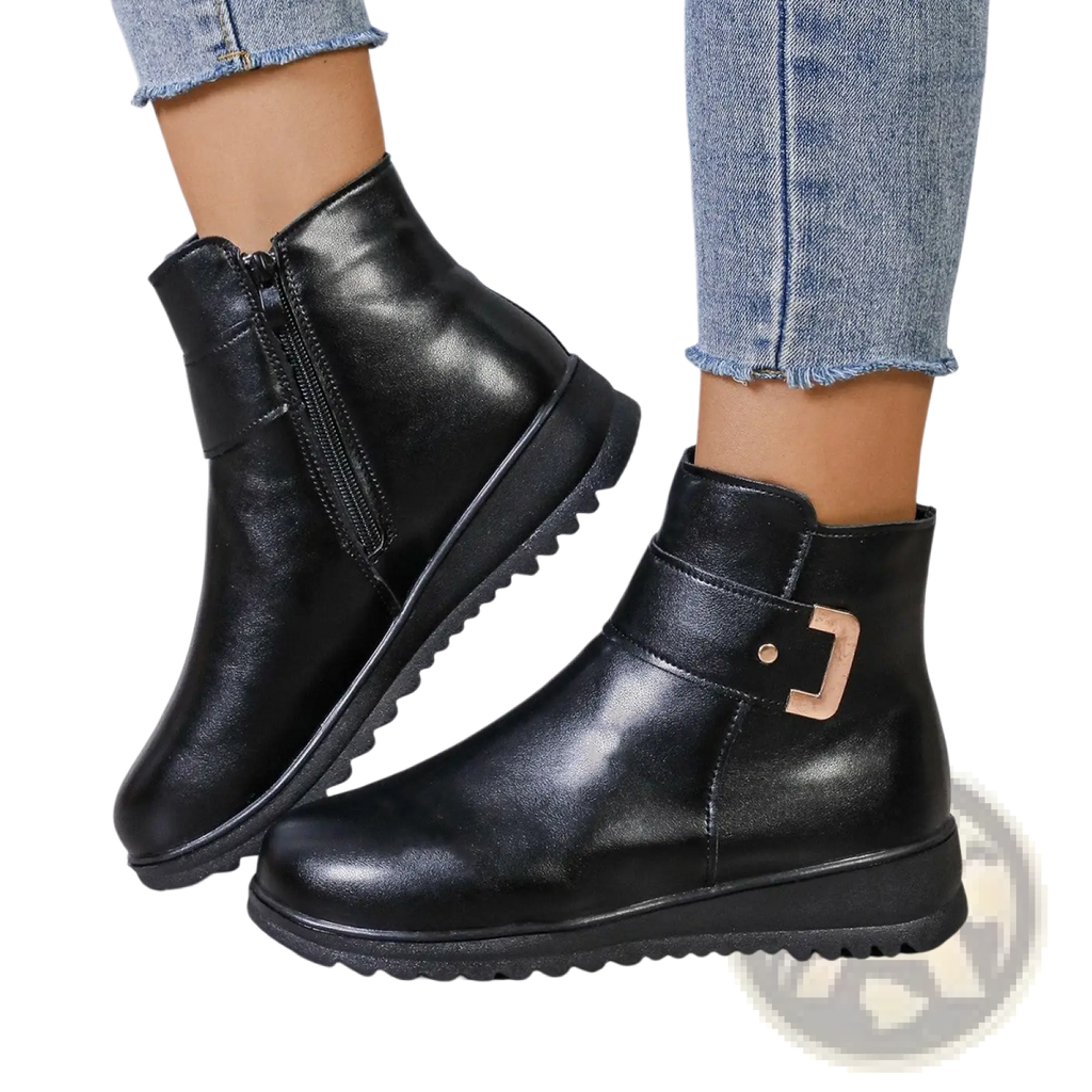 Black leather women’s winter fleece ankle boots with gold-tone buckle and textured rubber sole for cold weather use