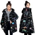 Black women’s winter parka with thick cotton padding and glossy graphic print featuring colorful text and illustrations