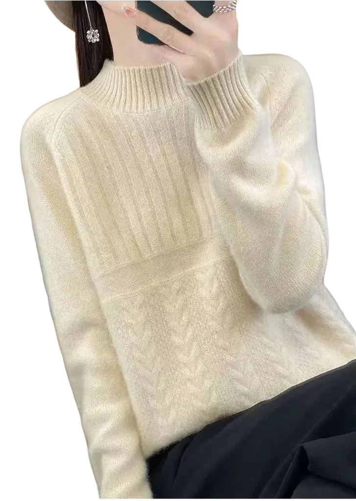 Cream-colored women’s wool knit pullover sweater with long sleeves ribbed high neckline and cable-knit pattern