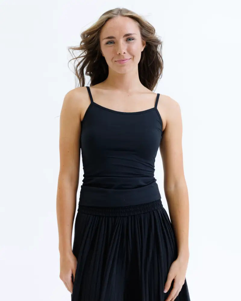 Black wonder cami cotton stretch layering tank top with spaghetti straps and gathered waistband in soft fabric