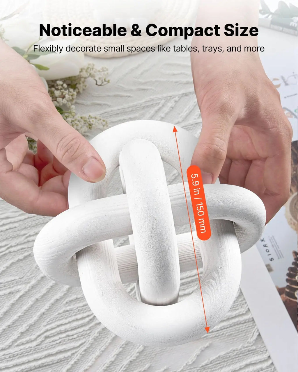 White matte-finished ceramic knot-shaped decorative object resembling a wood chain link pine wood knot decor piece