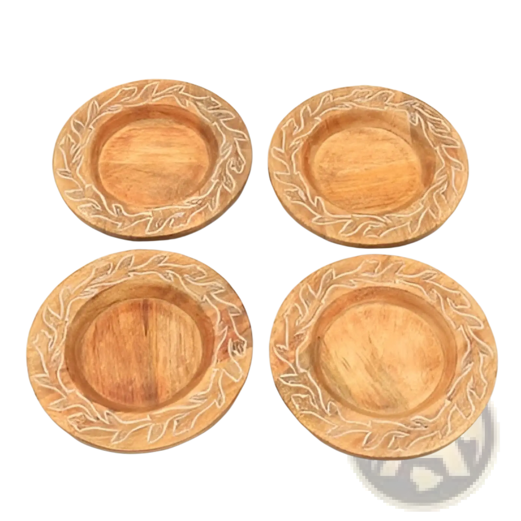 Set of four light brown wooden coasters with handcrafted carved leaf patterns along the rim for decorative use