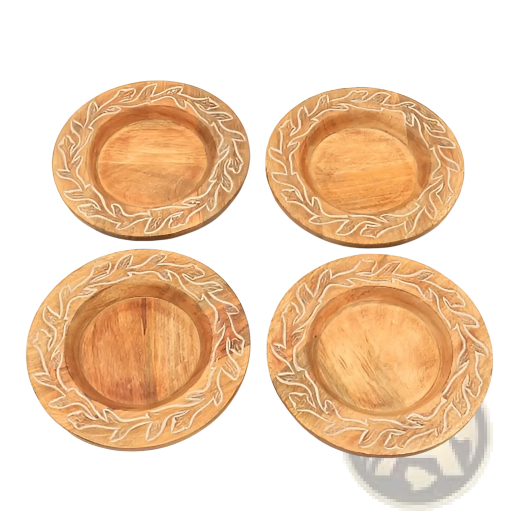 Set of four round wooden coasters with carved leaf patterns and natural light brown finish handcrafted rustic tableware