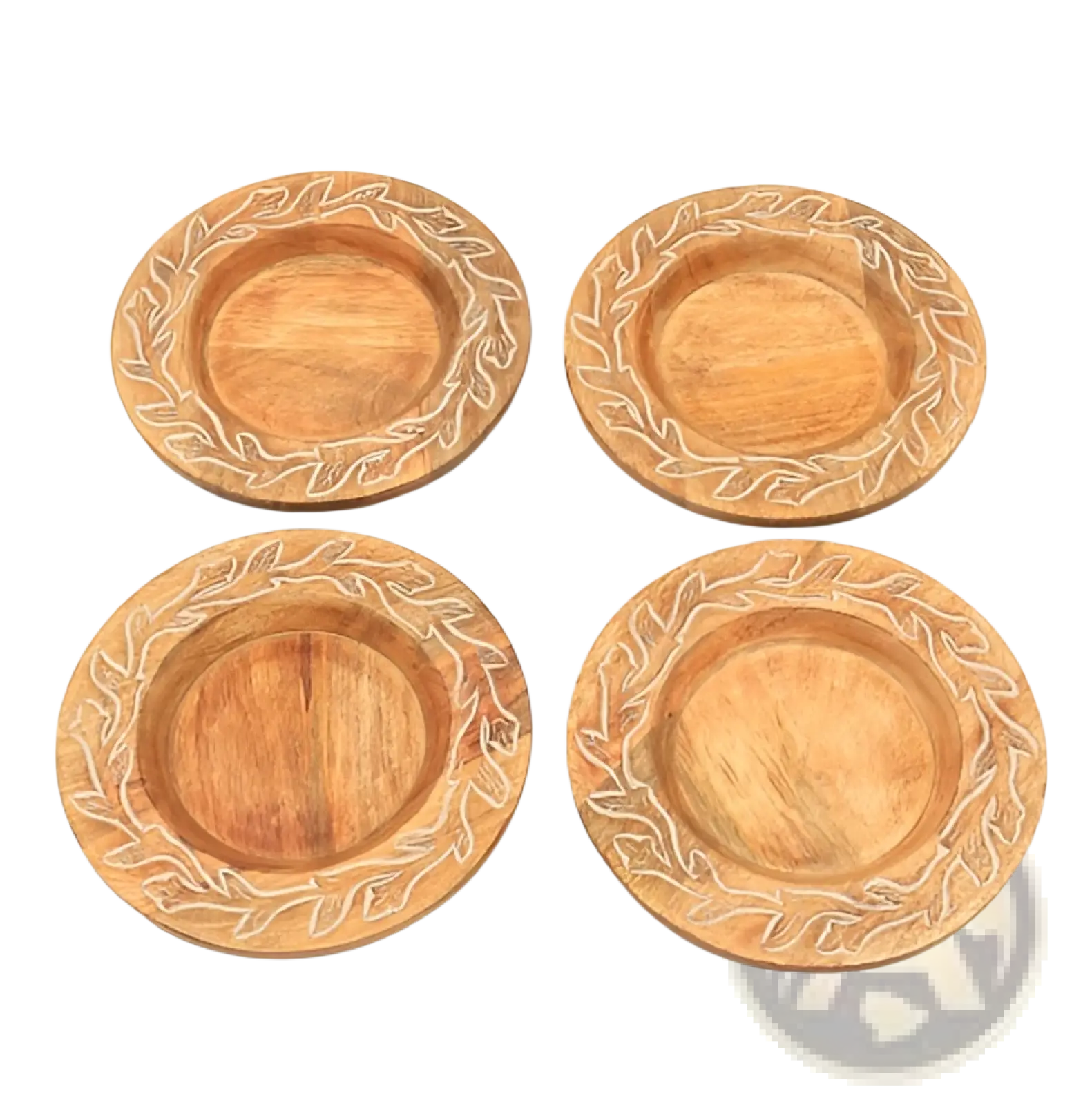 Set of four round wooden coasters with carved leaf patterns and natural light brown finish handcrafted rustic tableware
