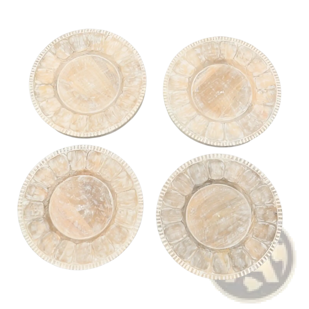 Set of four distressed white wooden coasters with scalloped edges and subtle wood grain texture for rustic tableware