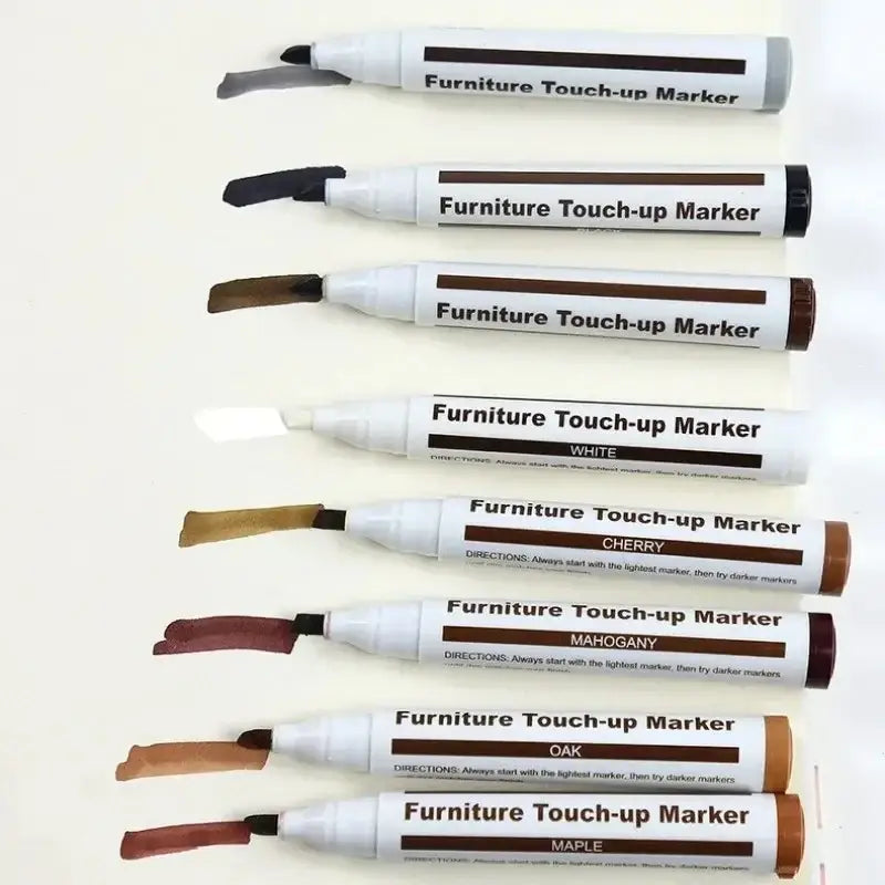 Set of seven wood furniture repair markers with white caps and colored labels for touch-up and scratch removal