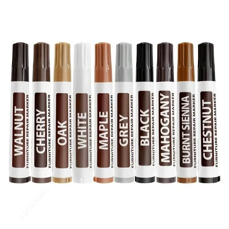 Set of eight wood furniture repair markers in assorted tones including walnut cherry oak maple grey black mahogany and chestnut
