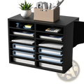 Black wood literature organizer with 12 adjustable slots holding binders documents topped with plant and storage box